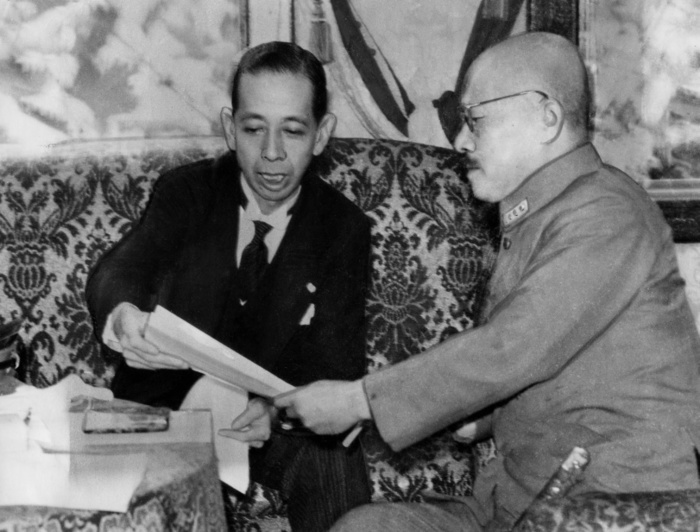 Nobusuke Kishi Hideki Tojo  October 14, 1943  Nobusuke Kishi having an administrative meeting with Prime Minister Hideki Tojo  right  on October 14, 1943.