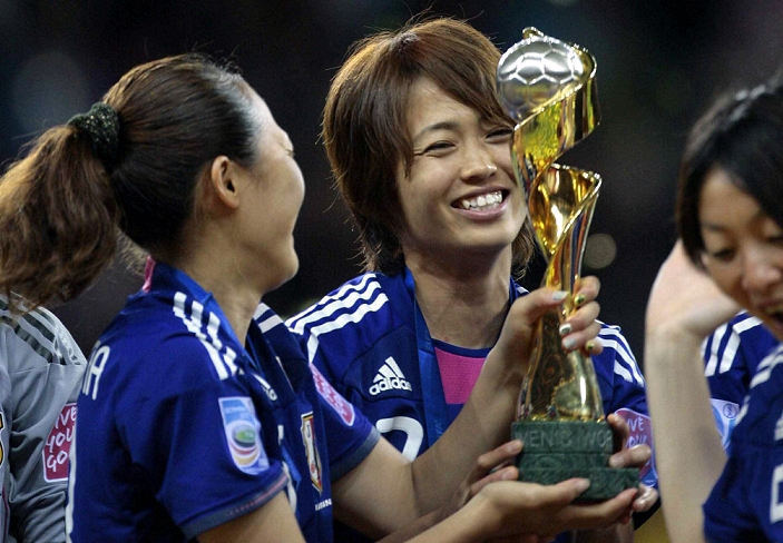 2011 FIFA Women s World Cup Nadeshiko Japan wins first place  L R  Karina Maruyama, Kozue Ando  JPN , JULY 17, 2011   Football   Soccer : Karina Maruyama and Kozue Ando of Japan celebrate with the trophy after winning the FIFA Women s World Cup Germany 2011 Final match between Japan 2 3 1 2 United States at Commerzbank Arena in Frankfurt, Germany. Photo by AFLO 