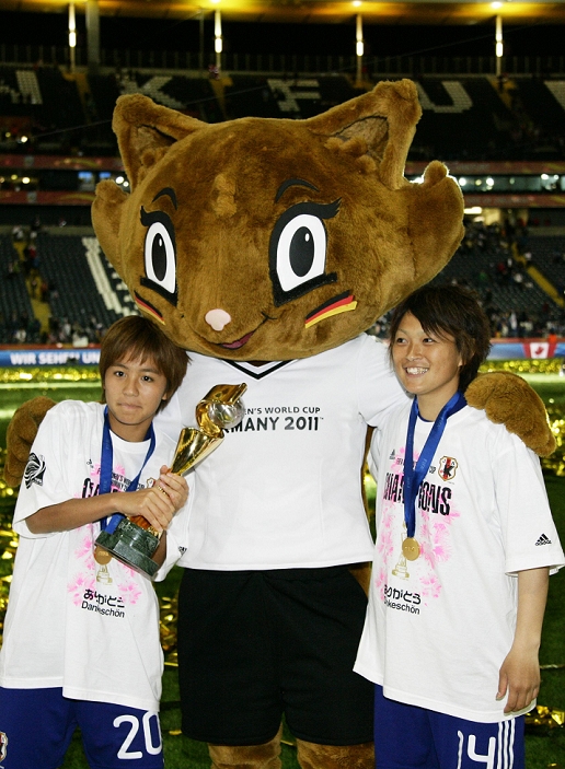 2011 FIFA Women s World Cup Nadeshiko Japan wins first place  L R  Mana Iwabuchi, Megumi Kamionobe  JPN , JULY 17, 2011   Football   Soccer : Mana Iwabuchi and Megumi Kamionobe of Japan celebrate with the trophy and Karla Kick, the official mascot for the FIFA Women s World Cup Germany 2011, after winning the Mana Iwabuchi and Megumi Kamionobe of Japan celebrate with the trophy and Karla Kick, the official mascot for the FIFA Women s World Cup Germany 2011, after winning the FIFA Women s World Cup Germany 2011 Final match between Japan 2 3 1 2 United States at Commerzbank Arena in Frankfurt, Germany.