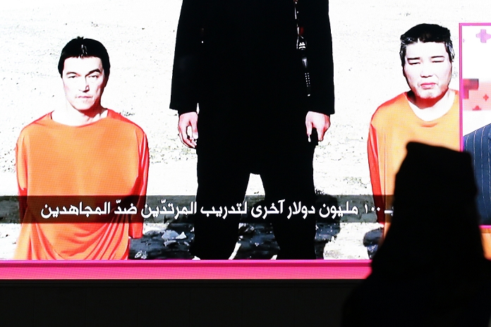 Islamic State Japanese hostage crisis Tension Continues as  Deadline  Lapses A giant TV monitor shows two Japanese hostages held by the Islamic State group, in Tokyo on Friday, January 23, 2015.  Photo by Yuriko Nakao AFLO 