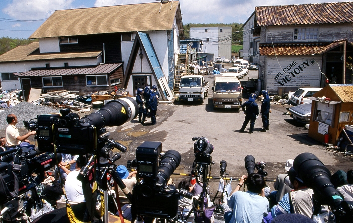 Cult group Aum Shinrikyo.  May 16, 1995  May 16, 1995, Kamikuisshiki Mura, Japan   Members of the domestic and foreign media take up their position as police raids on Aum s facility   No. 6 Satyam   on the foot of Mt. Fuji on May 16, 1995. On the morning of 20 March 1995, cult members released sarin in a coordinated attack on five trains in the Tokyo subway system, killing 13 commuters, seriously injuring 54 and affecting 980 more. Some estimates claim as many as 6,000 people were injured by the sarin.  Photo by Haruyoshi Yamaguchi AFLO  VTY  mis 
