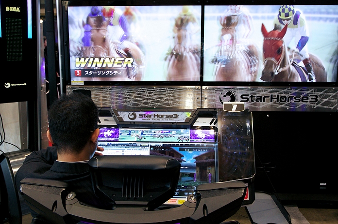 Festival of Arcade Games Large scale trade fair in Makuhari Japan Amusement Expo 2015 on February 13, 2015, Chiba, Japan : A visitor tests brand new game machines at Japan Amusement Expo 2015 in Makuhari Messe International Exhibition. The Expo is on of the largest amusement machine and equipment exhibitions in the world, featuring arcade games machines, sticker photos, play equipment, coin op, redemption prizes and simulation machines. The exhibition is held from February 13 to 14 2015.  Photo by Rodrigo Reyes Marin AFLO 
