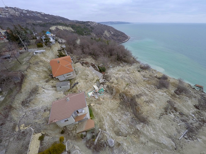 Landslide in Bulgaria Taken from above by an unmanned aerial vehicle An aerial view picture taken via drone shows destroyed homes by landslide as another more than hundreds houses are in danger as an the lindslide activated it s mouvment again last days in the Black sea town of Balchik, north east of the Bulgarian capital Sofia, Saturday, Feb. 22, 2015. Several homes have been destroyed by this landslide and six people died in the floods in the Balkan country two weeks ago. Photo by: Petar Petrov Impact Press Group  
