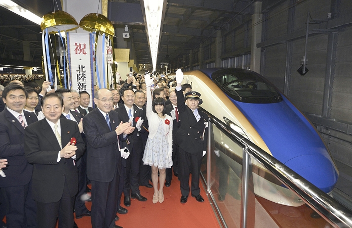 Commemorative Ceremonies at Stations for Hokuriku Shinkansen Line Extension Opening The first train of the Hokuriku Shinkansen,  Kagayaki 500,  departs at the signal of Kanazawa Station Chief  right  and actress Tao Tsuchiya  second from right .  The 228 km Hokuriku Shinkansen line between Nagano and Kanazawa opened for service on April 14. The train between Tokyo and Kanazawa  450.5 km  took about 1 hour and 20 minutes less than before, making it the fastest train to connect the two cities in 2 hours and 28 minutes. The distance between Tokyo and Toyama was also shortened by about 1 hour to 2 hours and 8 minutes. The Tokyo Nagano line has been in operation since 1997, and this is the first time in 18 years that the line has been extended. At JR Kanazawa Station, March 14, 2015  photo by Kyodo News 