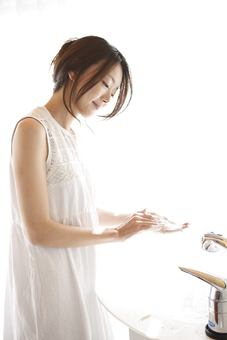 Japanese woman washing her hands