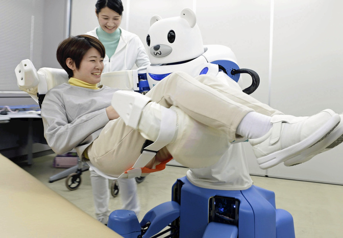 rebear ROBEAR, a nursing care robot that lifts a woman acting as a caregiver out of bed and moves her  2 3, in Moriyama Ward, Nagoya City    photo by Masahiro Sugimoto February 23, 2015