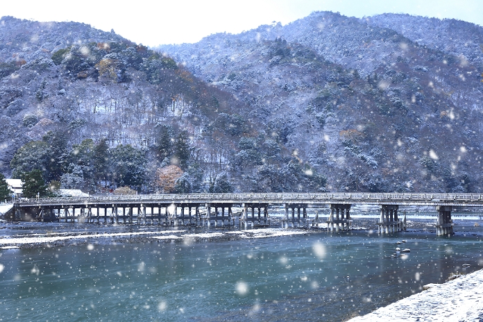 Watarigetsukyo Bridge and Katsuragawa River in snowy landscape, Arashiyama, Kyoto