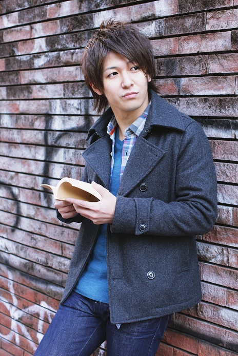 Japanese man holding a book