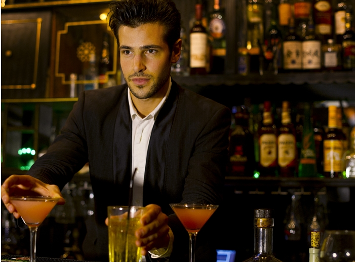 Bartender serving cocktails