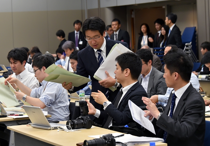 Honda s Net Income Down 9 Recall costs mount April 28, 2015, Tokyo, Japan   An employee of  Japan s Honda Motor Co. distributes papers to the media before Honda presents the fiscal fourth quarter results during a news conference at its head office in Tokyo on Tuesday, April 28, 2015. The automaker s profit dropped 43 percent as the costs of air bag recalls offset the positive of a weakyen and strong vehicle sales in Asia.   Photo by Natsuki Sakai AFLO  AYF  mis 
