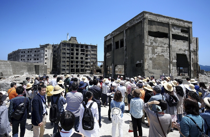 Industrial Revolution Heritage of Meiji Japan Recommendation for Registration as a World Cultural Heritage Site Tourists landing on Hashima Island  Gunkanjima , Nagasaki, at 0:04 p.m. on May 5.