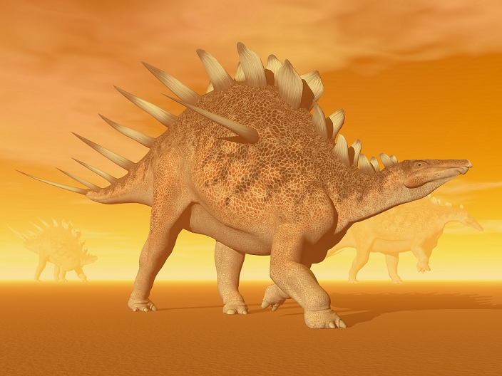 Three Kentrosaurus dinosaurs in the desert with hazy sunset light.