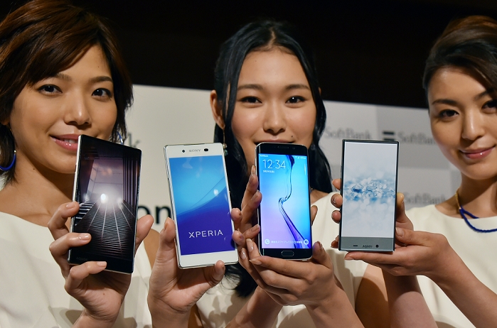 SoftBank Announces Summer Products New models and services May 19, 2015, Tokyo, Japan   Models poses with a new lineup of mobile terminals released by Japan s SoftBank Mobile Corp. for 2015 summer and service during a launch at a Tokyo hotel on Tuesday, May 19, 2015. The smartphones are, from left: Aquos Xx, Xperia Z4, Galaxy S6 and Aquos Crystal 2.  Photo by Natsuki Sakai AFLO  AYF  mis 