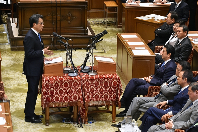 First Party Leaders  Debate in this Diet Session Discussion on Security Legislation, etc. May 20, 2015, Tokyo, Japan   Katsuya Okada, standing at left, of the opposition Democratic Party of Japan, asks questions to Prime Minister Shinzo Abe The debate focused on security related bills submitted t the Diet. When enacted, the bills would allow Japan to exercise its right of collective self defense on a limited basis.  mis 