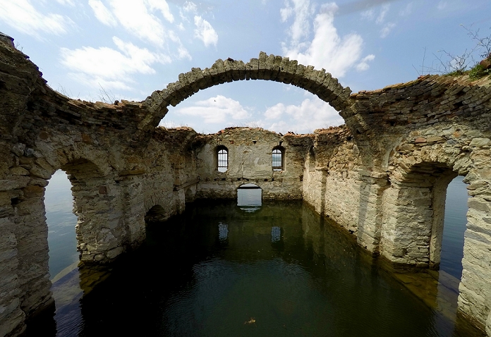 A Church Nestled in a Dam Tourist Attractions in Bulgaria Spring A wiew of submerged church  St. Ivan Rilski  at Zhrebchevo dam near the town of Tvardica, east of the Bulgarian capital Sofia, , May, 05, 2015. The Church of St. Ivan Rilski was once part of a village of Zapalnya, settled around 15th century but during the Zhrebchevo dam construction  in year 1965 the whole area and village have been submerging. The only thing left as evidence of the settlement are the ruins of this church wich every year in the Spring time surfaced as become one of most popular tourist attraction in the area. Sometimes when the waters cover the church over it becames and attraction for the scuba divers. Photo by: Petar Petrov Impact Press Group 