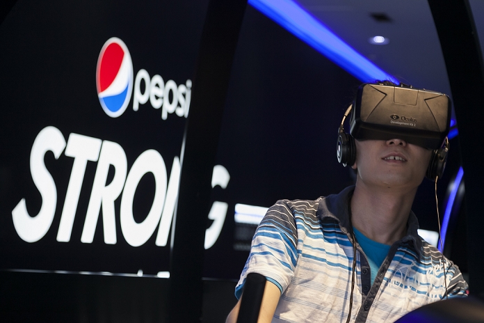 PEPSI to Open Limited Edition Bar in Harajuku, Tokyo Promoting new carbonated products A man plays with a virtual reality head mounter   OculusRift   at the   Pepsi Strong Bar   in Omotesando on June 20, 2015, Tokyo, Japan. The Strong Bar opened on June 11th to promote Pepsi Strong Zero in Japan, which went on sale on June 16th. Visitors can taste the new product for free if they share a Pepsi hashtag on social media.  Photo by Rodrigo Reyes Marin AFLO 