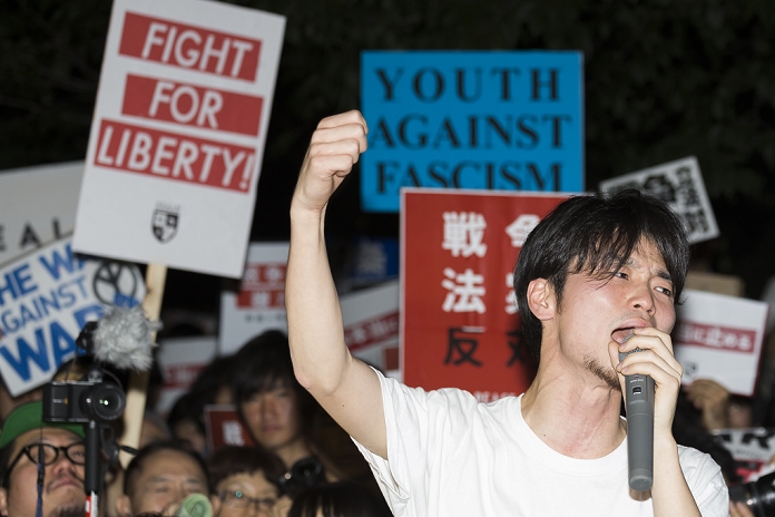 Students and Youth Demonstrate in Front of the National Diet against  War Legislation  Students and young people demonstrate in front of the National Diet Aki Okuda leader of the Students Emergency Action for Liberal Democracy s  SEALDs  protests against the revision of the pacifist Article 9 outside the Parliament building on July 10, 2015, Tokyo, Japan. According to the organizers more than 15 thousand people demonstrated in front of the Parliament building against Prime Minister Abe s reinterpretation of Article 9 which would enable the nation s troops to fight overseas.  Photo by Rodrigo Reyes Marin AFLO 