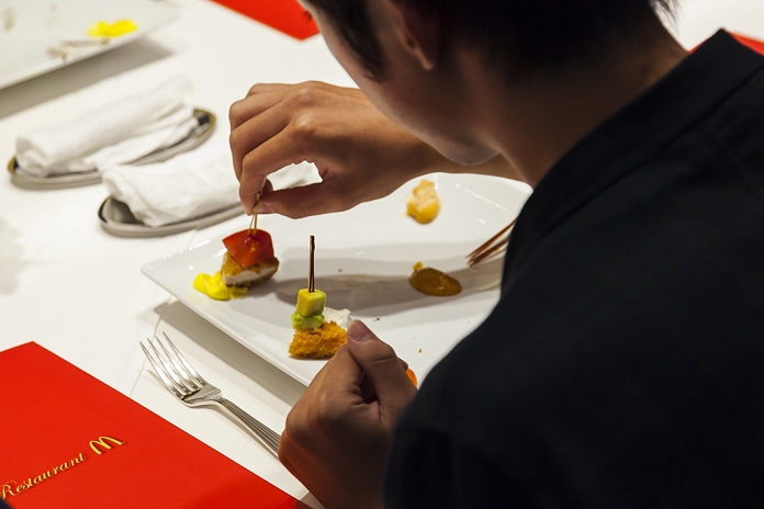Mac s Becomes a Fine Dining Restaurant One Night Only Commemorative Event A customer enjoys eating a McDonald s special dinner created by chef Masayo Waki during a   Restaurant M   event in the posh Roppongi Hills area on July 27, 2015, Tokyo, Japan. 20 chosen diners  from 8,300 applications  ate a special multi course dinner created by the celebrity chef using ingredients from the restaurant chain s regular menu. The special one night only event was organized to celebrate the launch of its new summer menu   Fresh Mac,   which features fresh vegetables. The five course meal served on a white tablecloth with plates and proper cutlery included a Vichyssoise en Pommes de terre de McDonald, Mousse au Poivron Rouge, Salade en Gelee aux Legumes de McDonald, Cinq Pinchos des McDonald Patties avec leur Sauces, a choice of main dish including the Fresh Mac Bacon Lettuce Burger, and a McFlurry Mixed Berry Oreo dessert with a Premium Roast Coffee.  Photo by Rodrigo Reyes Marin AFLO 