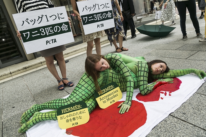 Criticized for handling of crocodiles PETA protests against Hermes Body painted models from PETA  the People For The Ethical Treatment of Animals organization  pose as slaughtered crocodiles in front of the luxury Hermes store in the upscale Ginza shopping district on July 30th, 2015 in Tokyo, Japan. PETA claims that Hermes bags and accessories use crocodiles and alligators that are kept in poor conditions and still conscious when being cut open. Japan is a big market for Hermes and luxury brands with many Asian tourists and Japanese visiting Ginza for shopping.  Photo by Rodrigo Reyes Marin AFLO 