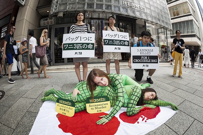 Criticized for handling of crocodiles PETA protests against Hermes Body painted models from PETA  the People For The Ethical Treatment of Animals organization  pose as slaughtered crocodiles in front of the luxury Hermes store in the upscale Ginza shopping district on July 30th, 2015 in Tokyo, Japan. PETA claims that Hermes bags and accessories use crocodiles and alligators that are kept in poor conditions and still conscious when being cut open. Japan is a big market for Hermes and luxury brands with many Asian tourists and Japanese visiting Ginza for shopping.  Photo by Rodrigo Reyes Marin AFLO 