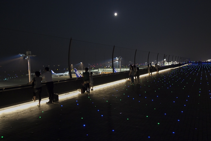 Blue moons  around the world Observed for the first time in about 3 years People watch a full moon as it rises over the skyline from Haneda Airport Terminal 2 on July 31, 2015, Tokyo, Japan. This is the second full moon in July and is known as a Blue Moon. There hasn t been a second full moon in a month since August 2012 and there won t be another one until January 2018.  Photo by Rodrigo Reyes Marin AFLO 
