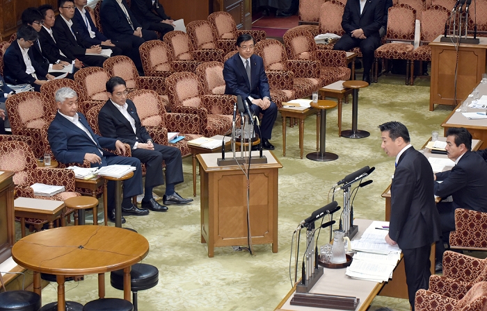 Aide Isozaki apologizes for remarks by a special committee member of the House of Councillors. August 3, 2015, Tokyo, Japan   Tetsuro Fukuyama, standing at right, of the opposition Democratic Party of Japan, fires questions to Yosuke Isozaki, seated at background right, a senior adviser to Japanese Prime Minister Shinzo Abe as he is summoned as an unsworn witness by a House of Councillors special panel on security legislation in Tokyo on Monday, August 3, 2015. Isozaki said recently that the legality of the contentious security bills currently being deliberated in the upper house was unimportant as was their consistency with the Constitution. His comment infuriated the opposition camp, which is now demanding his resignation.  Photo by Natsuki Sakai AFLO  AYF  mis 