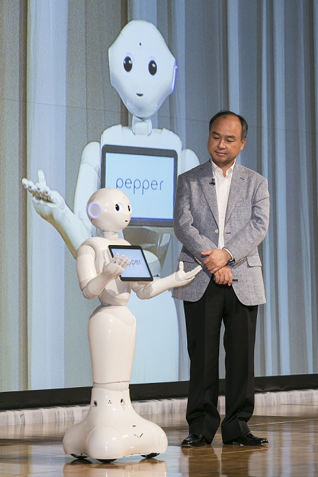 SoftBank Net Income Increased 2.8 Times Pepper  Announces Financial Results  L to R  Robot Pepper and SoftBank Chairman and CEO Masayoshi Son present the first quarter earnings  April June 2015  for SoftBank Group Corp. at the Prince Hotel in Tokyo, Japan, August 6, 2015. SoftBank Group reported a rise in operating profits to 343.6 billion yen   2.75 billion  from 319.4 billion a year ago. Mr. Son said net profit rose to 213.38 billion   1.71 billion  nearly triple the 77.57 billion reported a year earlier. This is the first time that Son has shared microphones with a robot to report earnings.  Photo by Rodrigo Reyes Marin AFLO 