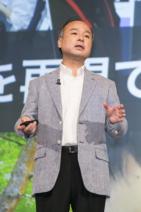 SoftBank Net Income Increased 2.8 Times Pepper  Announces Financial Results Chairman and CEO Masayoshi Son presents the first quarter earnings  April June 2015  for SoftBank Group Corp. at the Prince Hotel in Tokyo, Japan, August 6, 2015. SoftBank Group reported a rise in operating profits to 343.6 billion yen   2.75 billion  from 319.4 billion a year ago. Mr. Son said net profit rose to 213.38 billion   1.71 billion  nearly triple the 77.57 billion reported a year earlier. This is the first time that Son has shared microphones with a robot to report earnings.  Photo by Rodrigo Reyes Marin AFLO 