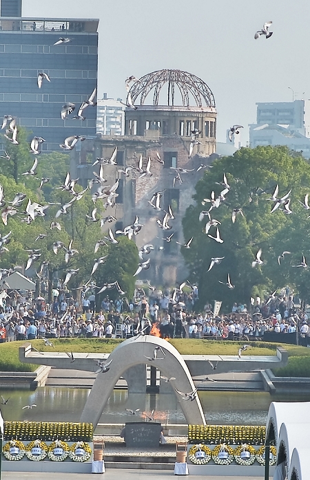 70th Anniversary of the Atomic Bombing of Hiroshima Peace Memorial Ceremony August 6, 2015, Hiroshima, Japan : Released doves fly during the 70th memorial ceremony of the atomic bombing at Hiroshima Peace Memorial Park in Hiroshima, Japan on August 6, 2015.  Photo by AFLO 