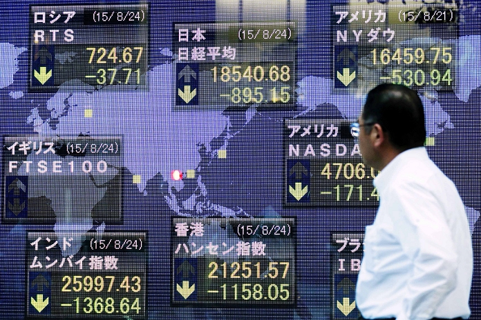Nikkei 225 falls below 19,000 yen Concerns about the global economic outlook A man looks at an electronic board showing the 225 issue Nikkei Stock Average which dropped 895.15 points or 4.61 percent to 18,540.68 at the end of trading on Monday, August 24, 2015, Tokyo, Japan. The Tokyo Stock Exchange tumbled more than 4  to a new low on Monday following massive declines in overseas markets on Friday and nervousness about China s economy. The Nikkei had dropped to a near five month low just 15 minutes after the market opened in the morning.  Photo by Rodrigo Reyes Marin AFLO 