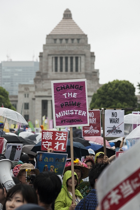 Demonstration against the Security Law Tens of thousands gathered in front of the Diet Protestors hold placards against the security bills, now being considered by the Upper House, outside the National Diet Building on August 30, 2015, Tokyo, Japan. Despite the rain many thousands of people gathered outside the Diet building carrying signs and banners criticizing the bills that could allow the nation s troops to fight overseas.  Photo by Rodrigo Reyes Marin AFLO 