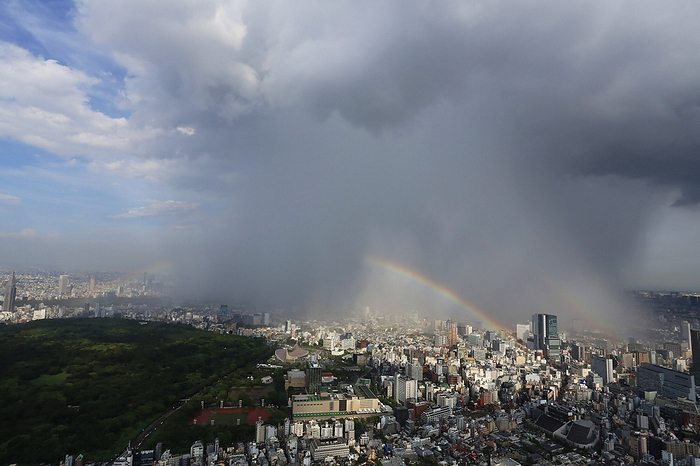 Central Tokyo covered by localized rain clouds A double rainbow hangs over the Shibuya, Tokyo, area due to localized rain clouds amidst blue skies around the area. The green area on the left is Yoyogi Park, photographed by Susumu Yamamoto from the Head Office helicopter at 2:54 p.m. on September 4, 2015 in Tokyo.
