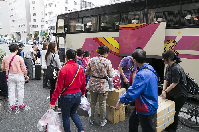 Chinese  Bakuhatsu Tour Visiting Japan for the National Day holiday Chinese tourists hold their shoppings in Shinjuku shopping district during the China National Day Golden Week holiday on October 5, 2015, Tokyo, Japan. The National Day Golden Week runs from October 1st to 7th, and Japan is the second position most popular overseas destination for Chinese tourists. According to CEIC Data, the numbers of Chinese tourists traveling aboard will increase from 116 million in 2014 to about 242 million in 2024, and visits to Japan are projected to rise taking advantage of a weak yen.  Photo by Rodrigo Reyes Marin AFLO 