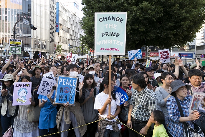 One month after the passage of the Security Law SEALDs and others rally in Shibuya Demonstrators hold placards calling for democracy during a protest organised by the Students Emergency Action for Liberal Democracy  SEALDs  group in front of Shibuya station, on October 18, 2015, Tokyo, Japan. One month after the Japanese Government approved a set of controversial security bills, members of SEALDs continue to call people to protest against the shift in the Japanese defence policy which they believe is against the country s constitution and un democratic.  Photo by Rodrigo Reyes Marin AFLO 