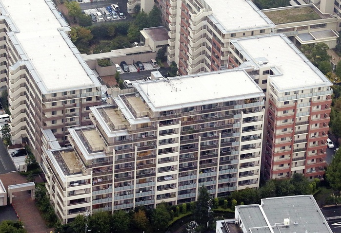 Yokohama condominium tilt problem  A large condominium building sold by the Mitsui Fudosan Group  in the foreground is the west wing, which was found to be leaning   4:34 p.m., March 16, 2012, in Tsuzuki Ward, Yokohama City, as seen from the head office helicopter .