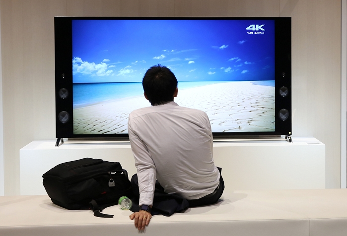 Sony Moves Back into the Black September 2015 Interim Results A man sits in front of Sony Corp. s 4K television displayed at the company headquarters in Tokyo, Japan, October 29, 2015.  Photo by Takeshi Sumikura AFLO 