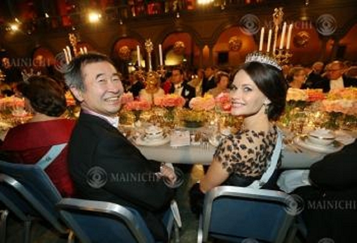 Nobel Prize 2015. Dinner in Stockholm Takaaki Kajita  left , Director of the Institute for Cosmic Ray Research at the University of Tokyo, at a table at the dinner party following the Nobel Prize ceremony. At right is Princess Sophia of Sweden at Stockholm City Hall, December 10, 2015, 7:24 p.m.  representative photo .
