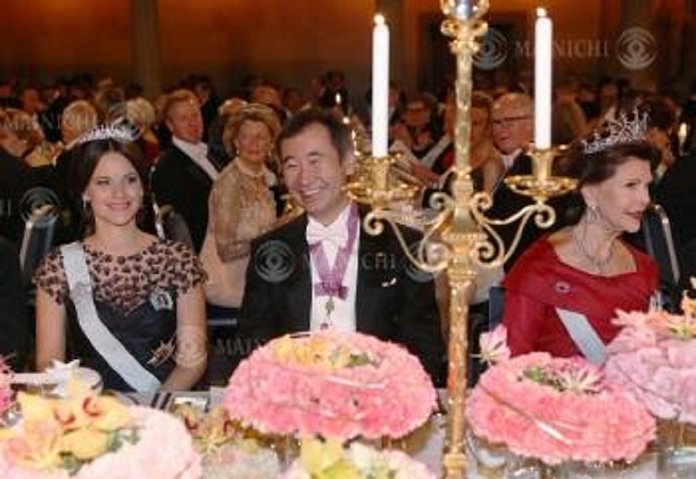 Nobel Prize 2015. Dinner in Stockholm Takaaki Kajita, Director of the Institute for Cosmic Ray Research at the University of Tokyo  center  at the table. On the right is Queen Silvia of Sweden, and on the left is Princess Sophia Philip, at Stockholm City Hall on the evening of December 10, 2015, representative photo.