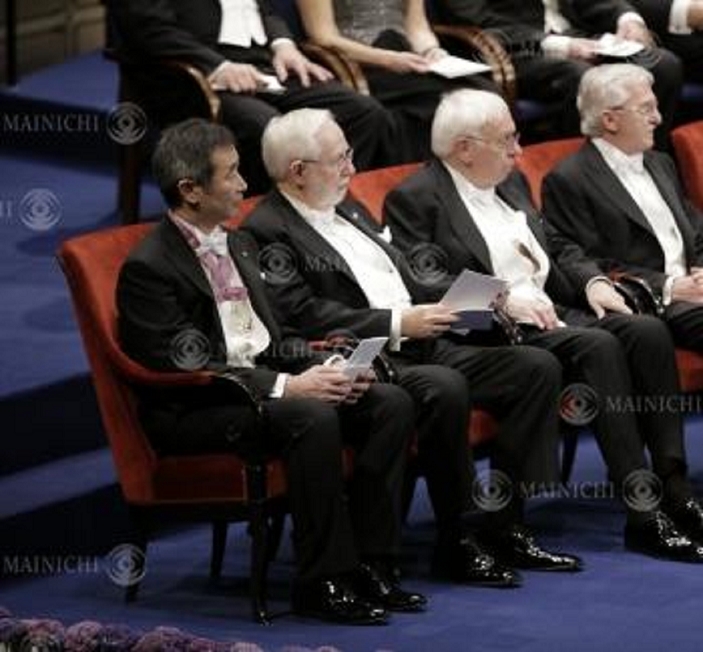 Nobel Prize 2015. Award ceremony in Stockholm Seated at the Nobel Prize ceremony venue are  from left  Takaaki Kajita, director of the Institute for Cosmic Ray Research at the University of Tokyo, and Professor Emeritus Arthur Macdonald of Queen s University, Canada, at the Concert Hall in Stockholm, December 10, 2015, 4:40 p.m.  representative photo 