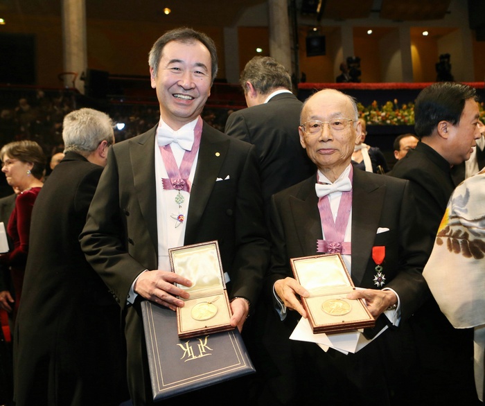Nobel Prize 2015. Award ceremony in Stockholm Takaaki Kajita  left , director of the Institute for Cosmic Ray Research at the University of Tokyo, and Satoshi Omura, special professor emeritus at Kitasato University, show their medals after the Nobel Prize ceremony in Stockholm, December 10, 2015, 5:48 PM  representative photo .