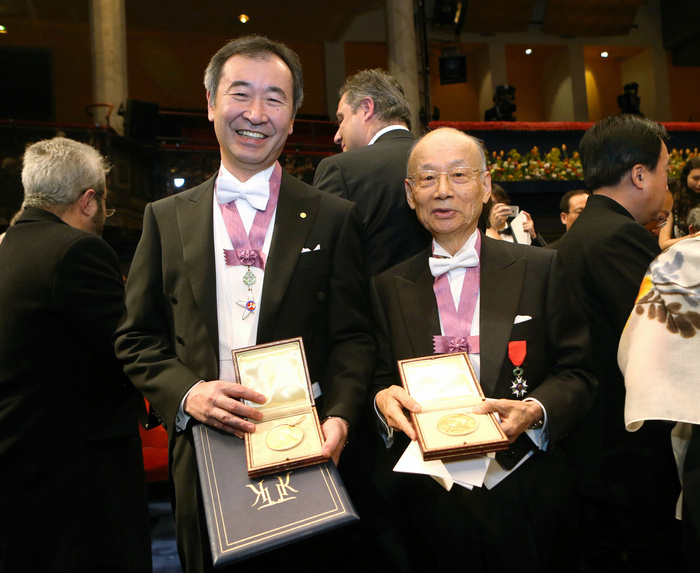 Nobel Prize 2015. Award ceremony in Stockholm Takaaki Kajita  left , director of the Institute for Cosmic Ray Research at the University of Tokyo, and Satoshi Omura, special professor emeritus at Kitasato University, show their medals after the Nobel Prize ceremony in Stockholm, December 10, 2015, 5:48 PM  representative photo .