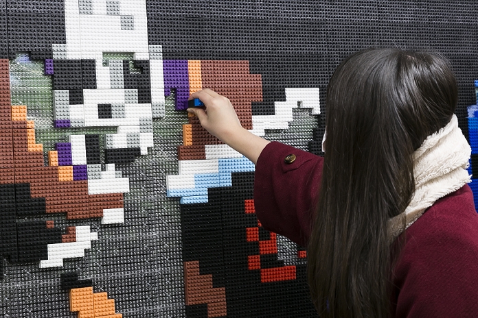 Massive Monster Attack in Shinjuku  Unblock and defeat them  Dragon Quest fans collect blocks from a giant Lego wall mural on January 28, 2016 in Tokyo, Japan. The mural is part of a promotion in Shinjuku Station to celebrate the release of new game Dragon Quest Builders. The 80 meter mural was made with 180,000 Lego blocks and fans were allowed to remove blocks to reveal a secret poster behind. Some blocks contained QR codes allowing fans to access exclusive content.  Photo by Rodrigo Reyes Marin AFLO 