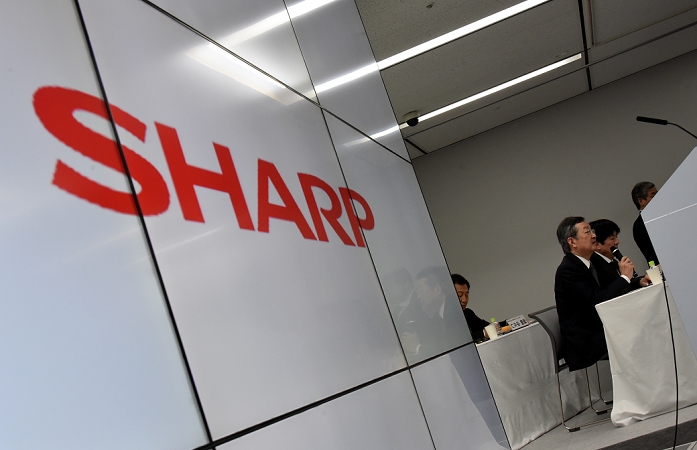 Sharp to be acquired by Hon Hai Restructuring under the umbrella of Hon Hai February 4, 2016, Tokyo, Japan   President Kozo Takahashi of Sharp Corp. speaks as it releases its third quarter earnings in Tokyo on Thursday, February 4, 2016. The Osaka based company posted a net loss of  918 million, bigger than expected shortfall for the April to December period. However, shares of the financially troubled electronics manufacturer surged about 26  ahead of its earnings release on reports it has entered into exclusive takeover talks with Taiwan s iPhone assembler Foxconn.  Photo by Natsuki Sakai AFLO  AYF  mis 