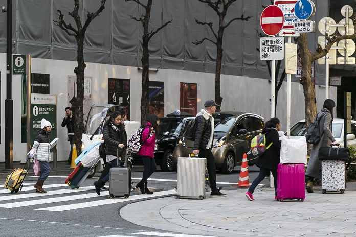 Chinese New Year 2016 is just around the corner Foreign tourists continue to arrive Tourists in the upmarket Ginza shopping area on February 5, 2016, Tokyo, Japan. This year the Chinese Lunar New Year falls on February 8th and many businesses in China, Taiwan and Korea are closed between the 7th 13th February. Tokyo is expecting thousands of visitors from these countries during the holiday period, especially after 2015 saw the number of Chinese visitors to Japan double compared with the previous year. According to The China Post, Tokyo is the the most popular overseas destination for Taiwanese travellers during the Lunar New Year holiday for the second consecutive year. The most popular products for Asian shoppers are cosmetics, electronic appliances, drugs and branded items.  Photo by Rodrigo Reyes Marin AFLO 