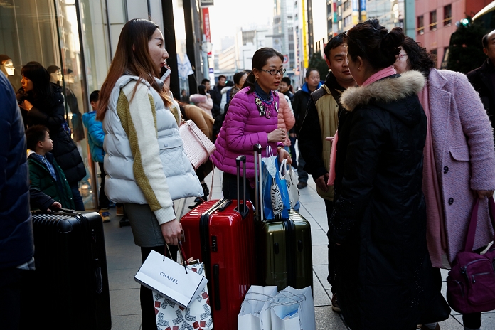 Chinese New Year 2016 Comes Around Chinese tourists continue to arrive Chinese tourists walk around for shopping during the Lunar New Year Holiday at Tokyo s Ginza shopping district in Japan on February 8, 2016.  Photo by AFLO 