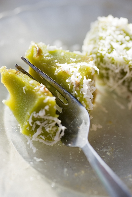 Pandan flavored rice cakes (kuih kosui) with shredded coconut