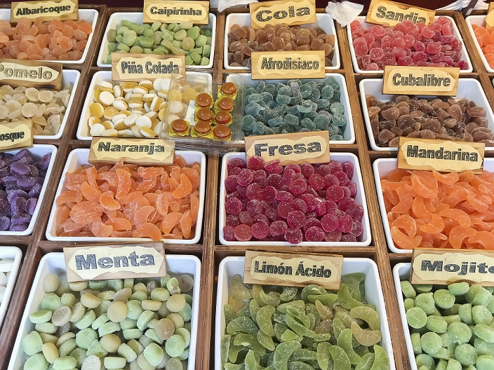 Assortment of coloful candy for sale in bins, Alicante, Spain