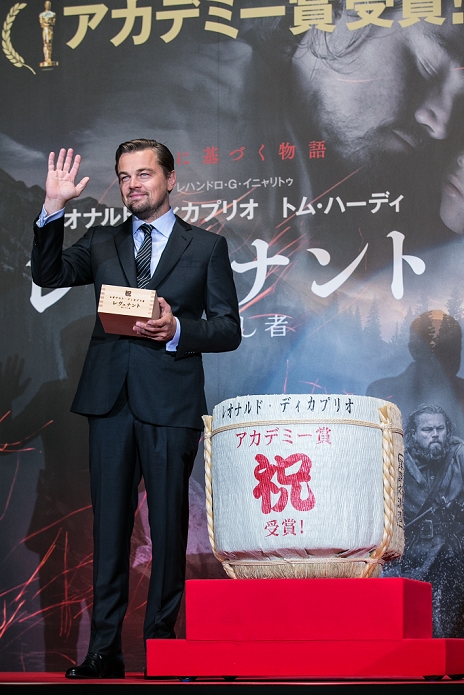 March 23, 2016, Tokyo, Japan - US actor Leonardo DiCaprio holds a Japanese traditional wooden sake cup next to a large sake barrel during the Japan premiere for the film 