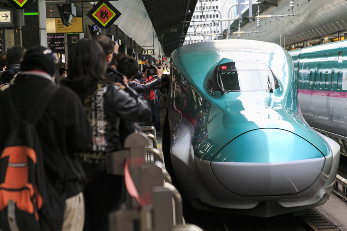 Hokkaido Shinkansen Line Opens Tokyo   Shin Hakodate Hokuto in 4 hours The Hayabusa Shinkansen  bullet train  pulls into Tokyo Station on March 26, 2016, Tokyo, Japan. The Hayabusa shinkansen connects Tokyo with the northern island of Hokkaido via the 53.85 km long Seikan Tunnel. Previously Japan s bullet train only operated as far as Aomori but the new rail link now goes to Shin Hakodate Hokuto Station in Hokkaido with a further extension planned to Sapporo by 2030. A one way ticket costs 22,690 yen  200 UDS  from Tokyo to Shin Hakodate Hokuto and the fastest trains will take 4 hours and 2 minutes for the journey.  Photo by Rodrigo Reyes Marin AFLO 