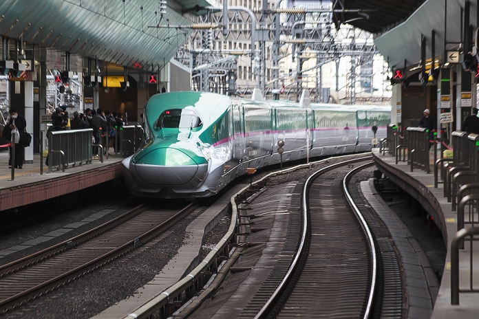Hokkaido Shinkansen Line Opens Tokyo   Shin Hakodate Hokuto in 4 hours The Hayabusa Shinkansen  bullet train  leaves Tokyo Station on its first day of operation on March 26, 2016, Tokyo, Japan. The Hayabusa shinkansen connects Tokyo with the northern island of Hokkaido via the 53.85 km long Seikan Tunnel. Previously Japan s bullet train only operated as far as Aomori but the new rail link now goes to Shin Hakodate Hokuto Station in Hokkaido with a further extension planned to Sapporo by 2030. A one way ticket costs 22,690 yen  200 UDS  from Tokyo to Shin Hakodate Hokuto and the fastest trains will take 4 hours and 2 minutes for the journey.  Photo by Rodrigo Reyes Marin AFLO 